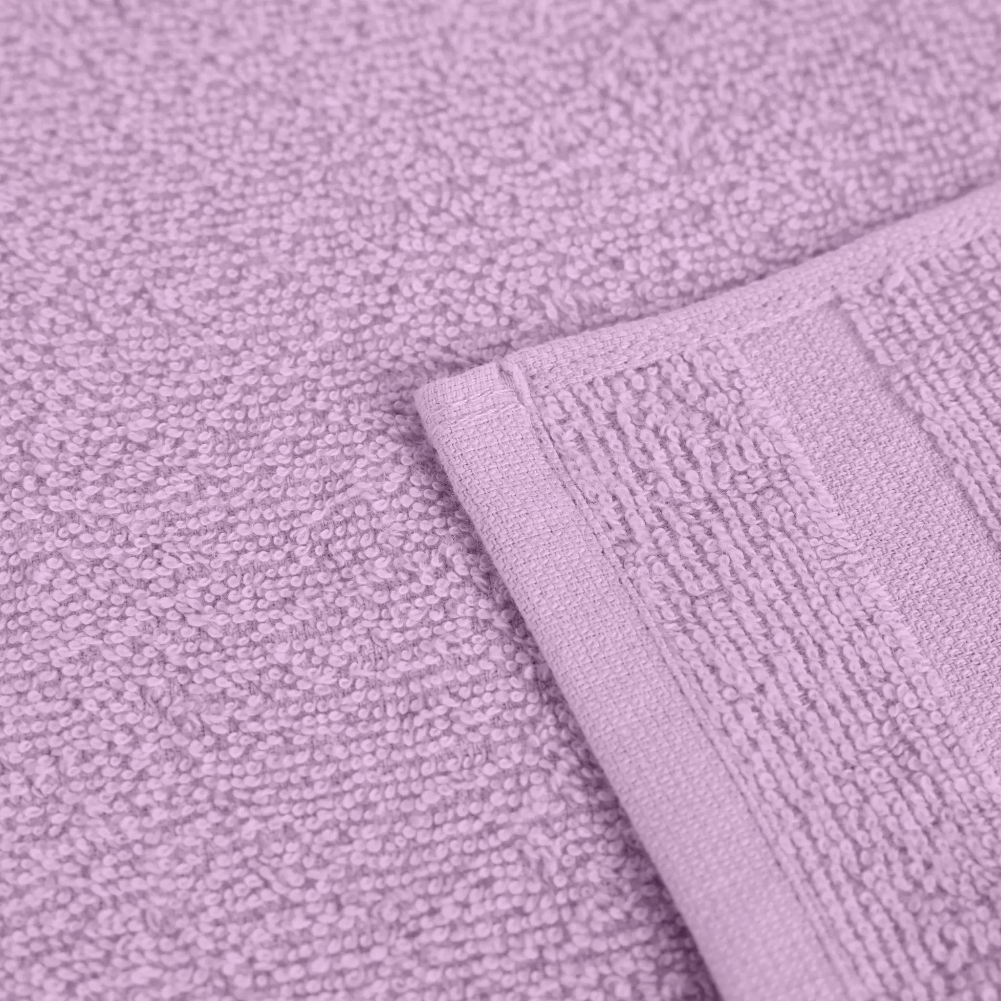 Close-up of textured lilac fabric with a folded corner