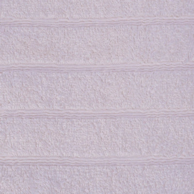 A close-up of an ivory textured bath towel with horizontal ribbed stripes.