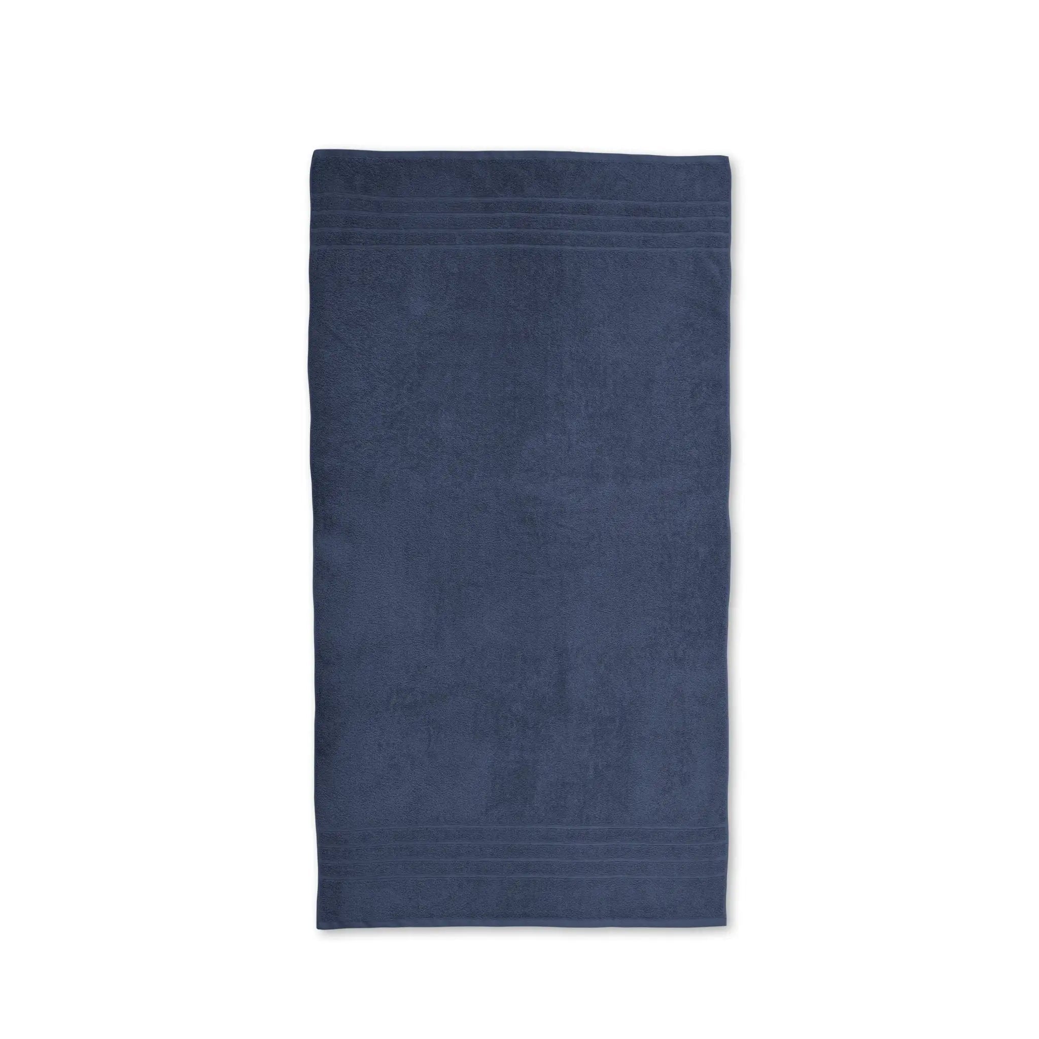 A single folded estate blue bath towel shown flat against a solid white background.