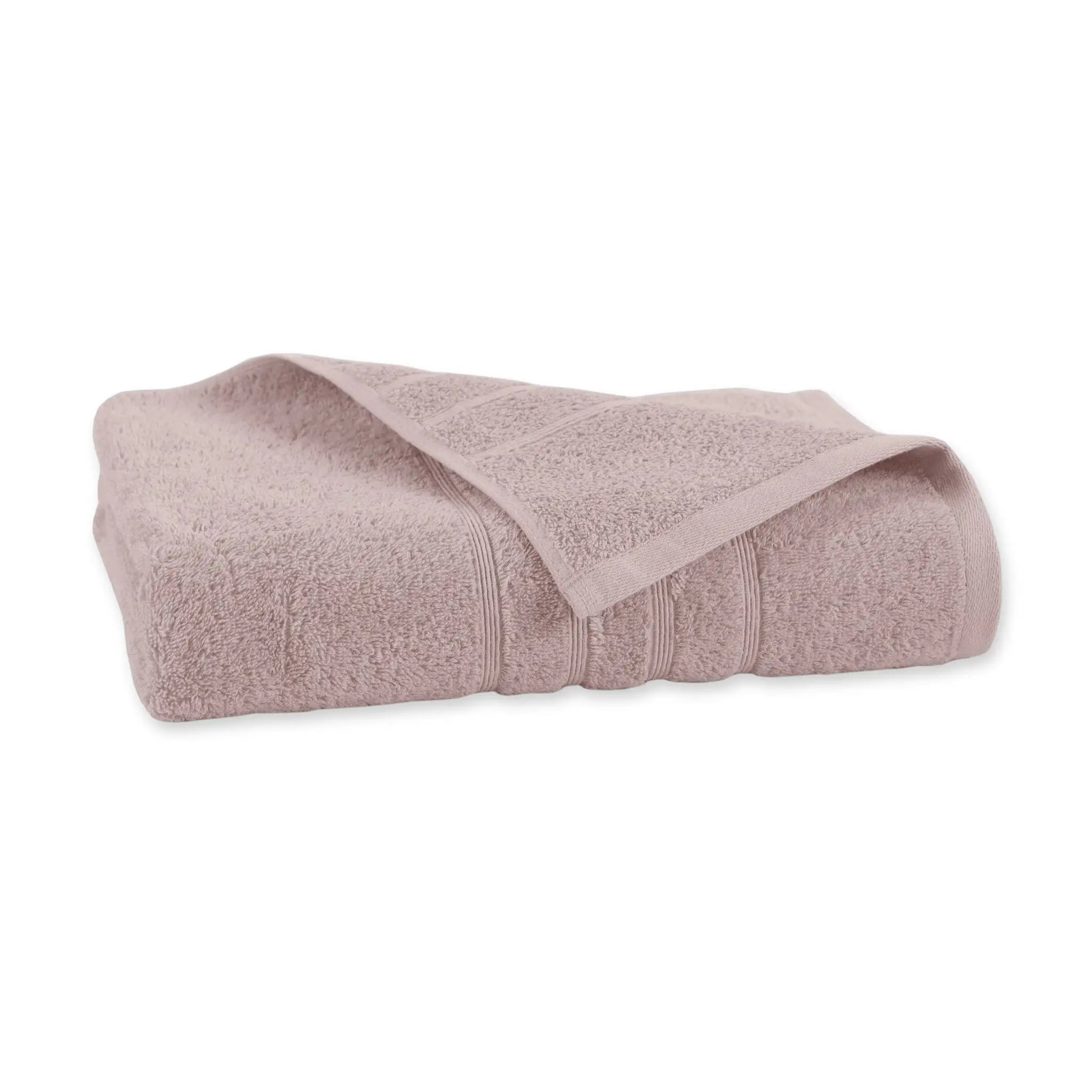 A folded pink color bath towel, showing its textured terry cloth weave and ribbed border, set against a plain white background.