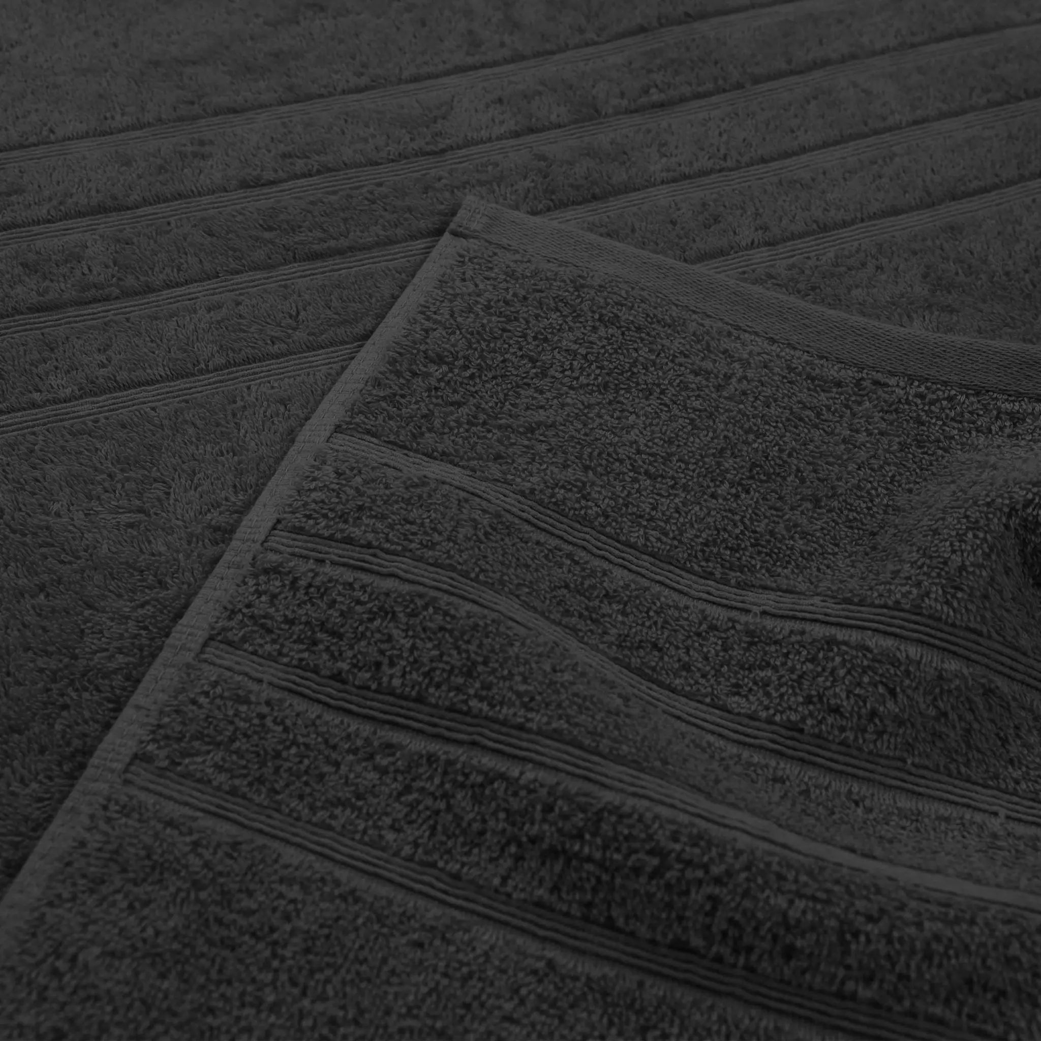 Close-up of a textured black bath towel  with a ribbed surface
