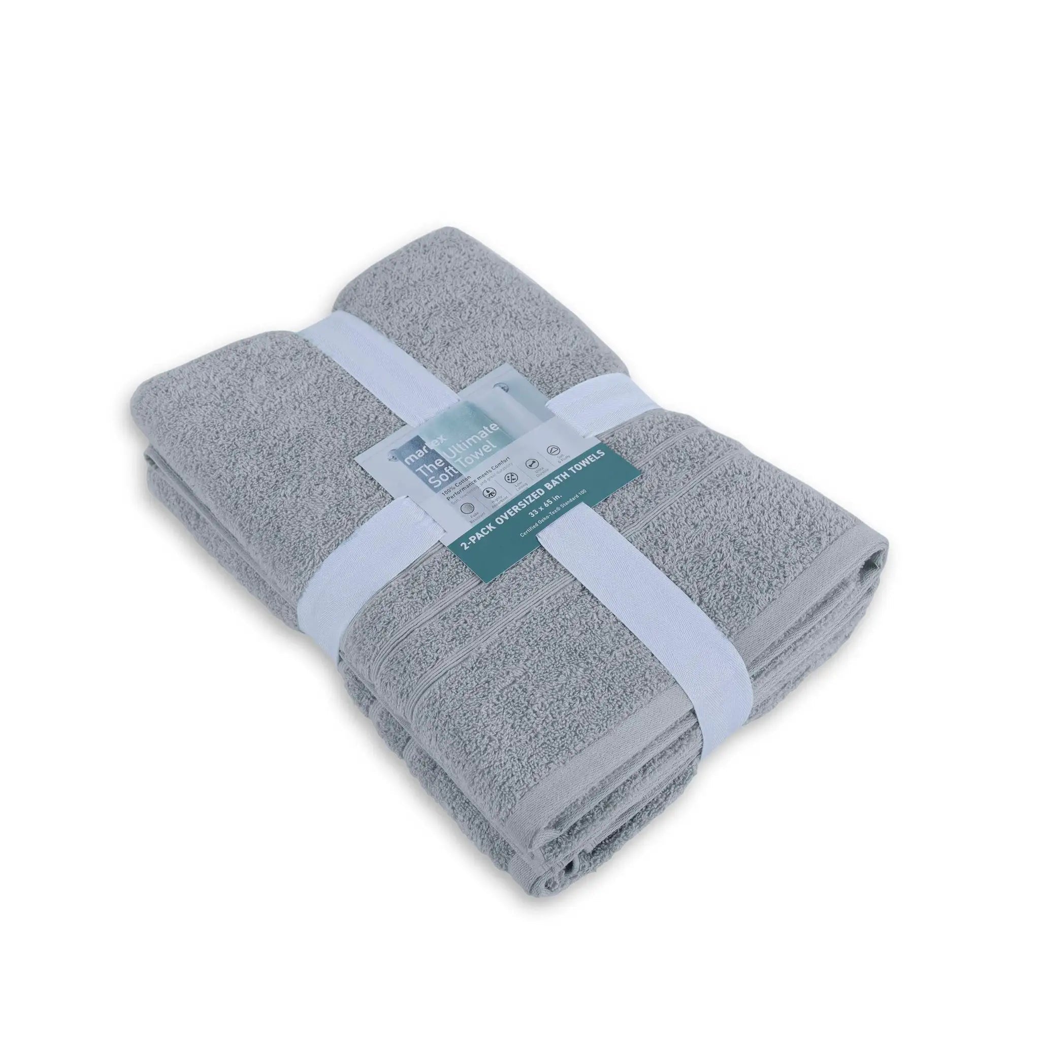 Folded spa blue bath sheet with a label on a white background