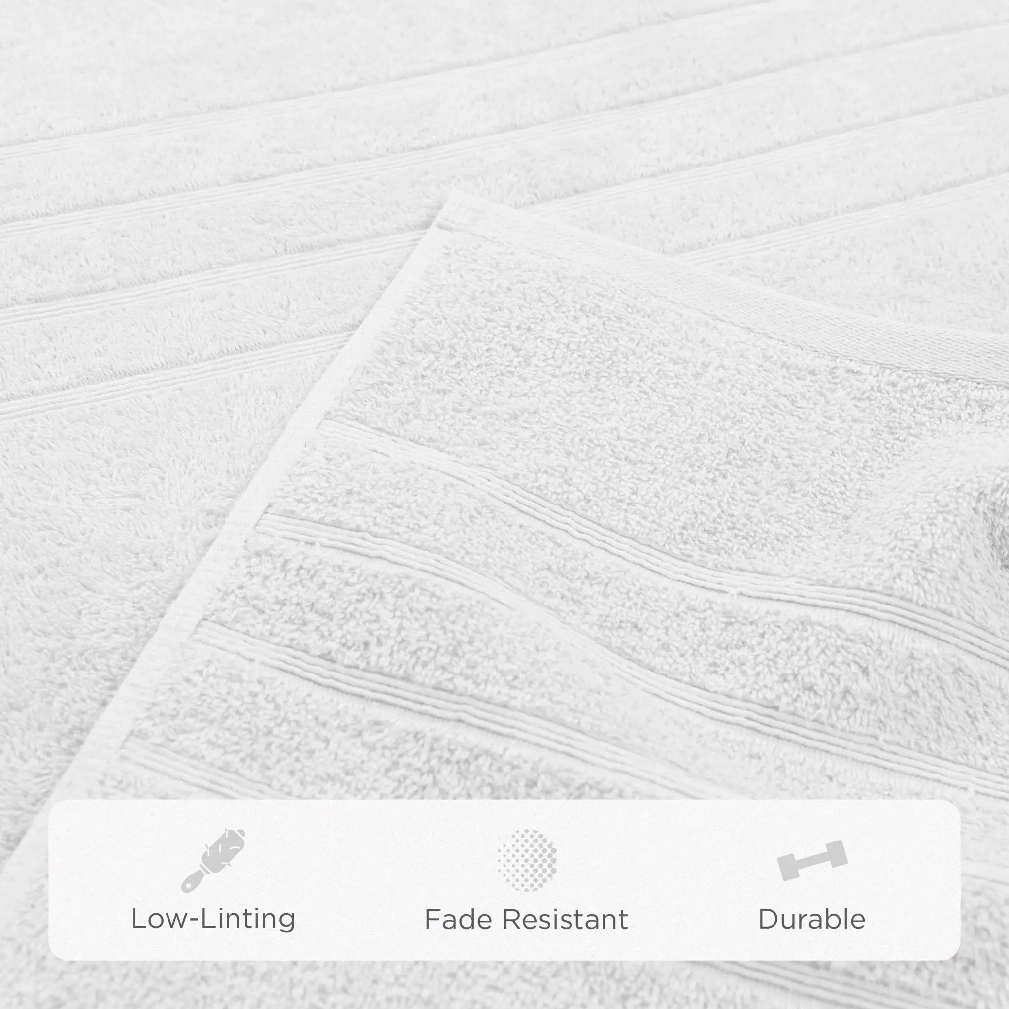 White textured bath sheets with a folded corner showing soft terry fabric and subtle horizontal ribbed detailing. A white banner at the bottom lists product benefits: Low-Linting, Fade Resistant, and Durable.