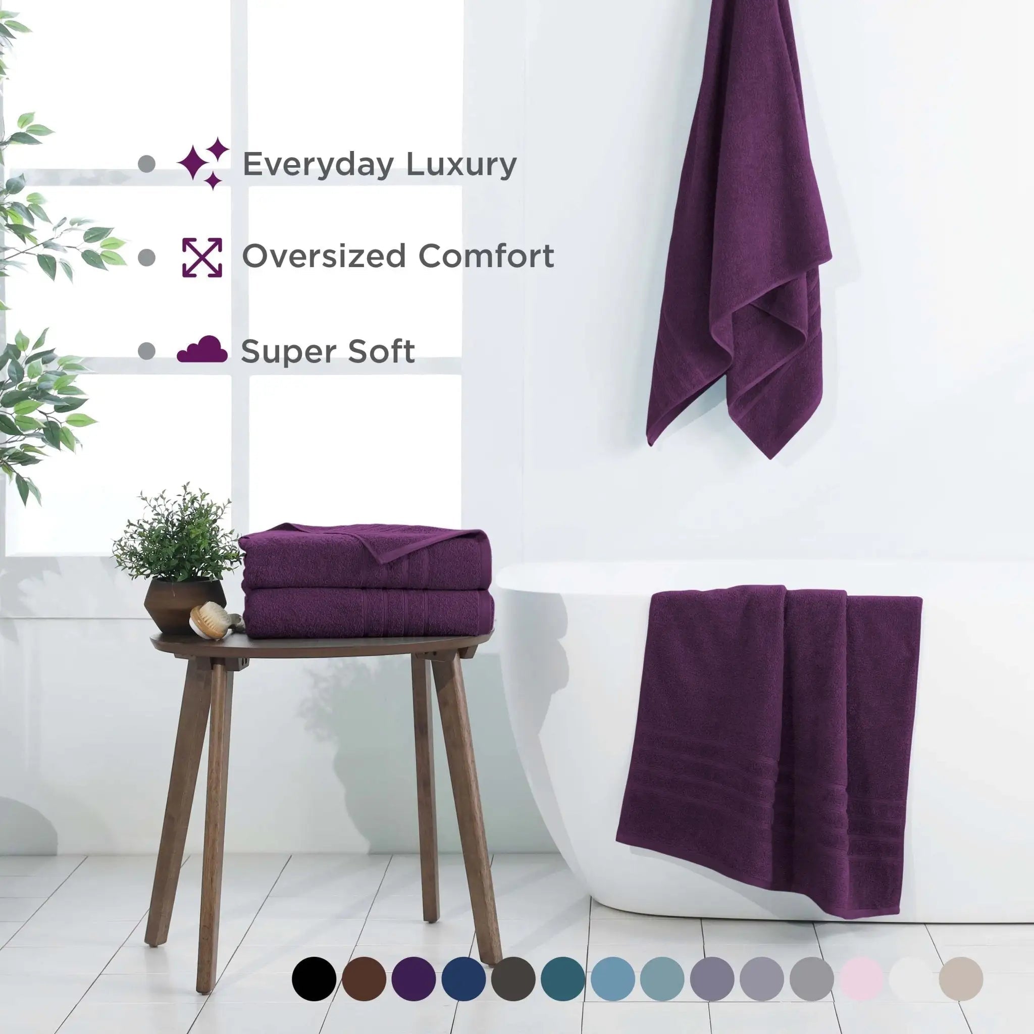 Purple bath sheets on a stool and hanging on a towel rack with text highlighting features.