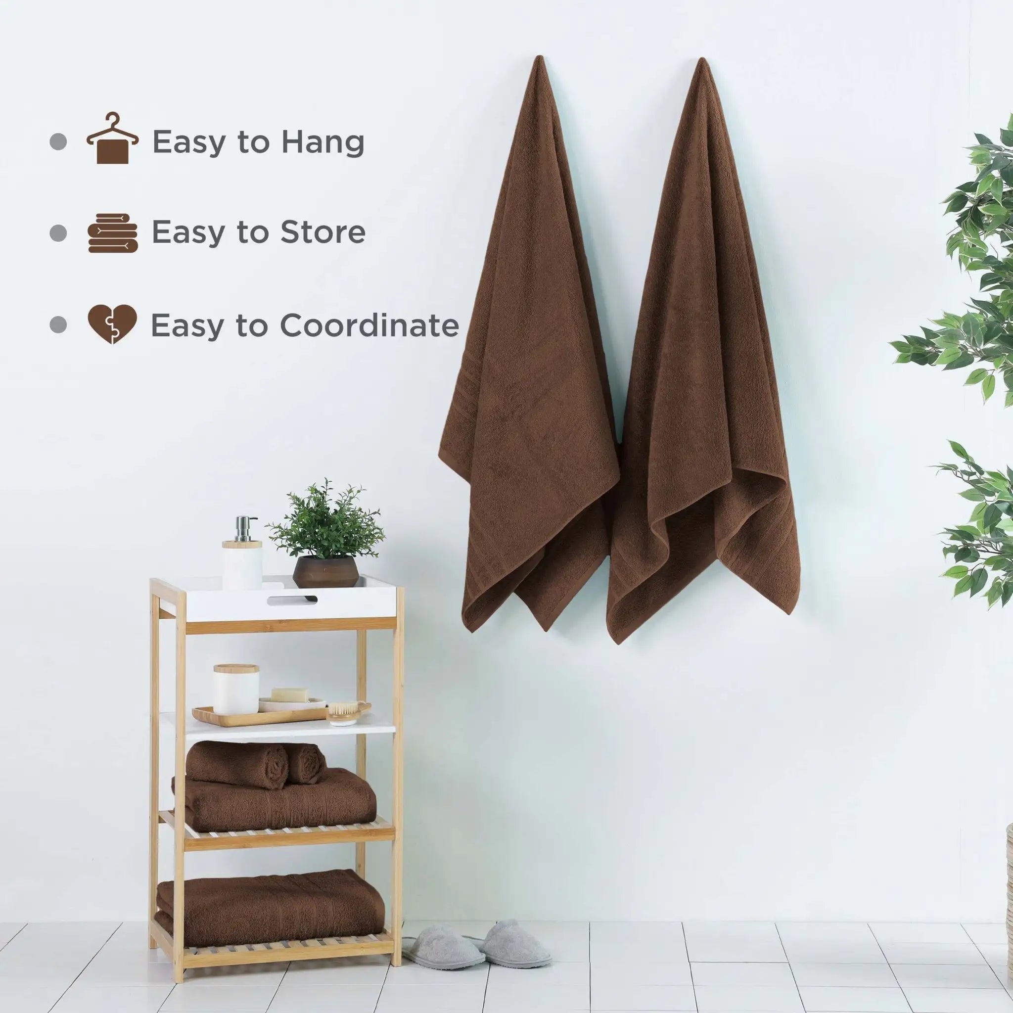 Chocolate colored bath sheets hanging on a wall with a wooden shelf below, featuring text about towel features.