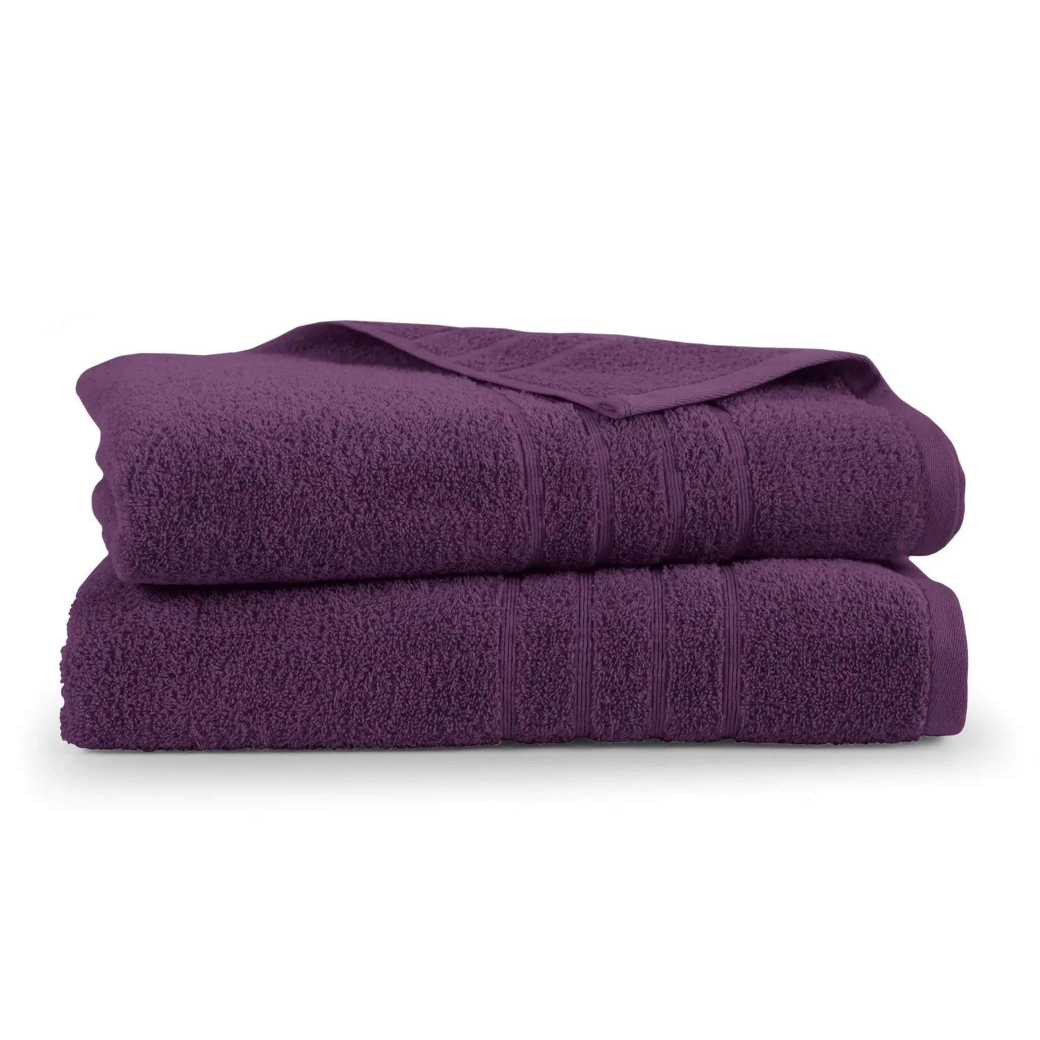 A stack of two folded purple cotton bath sheets with textured terry cloth surfaces and ribbed borders, photographed on a clean white background.