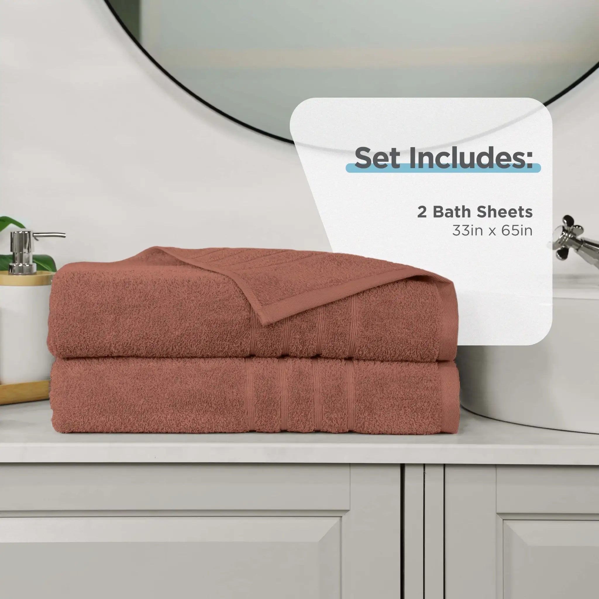 Two folded bath sheets in a terracotta color stacked on a white bathroom vanity, with a white sign overlay that reads 'Set Includes: 2 Bath Sheets 33in x 65in'.