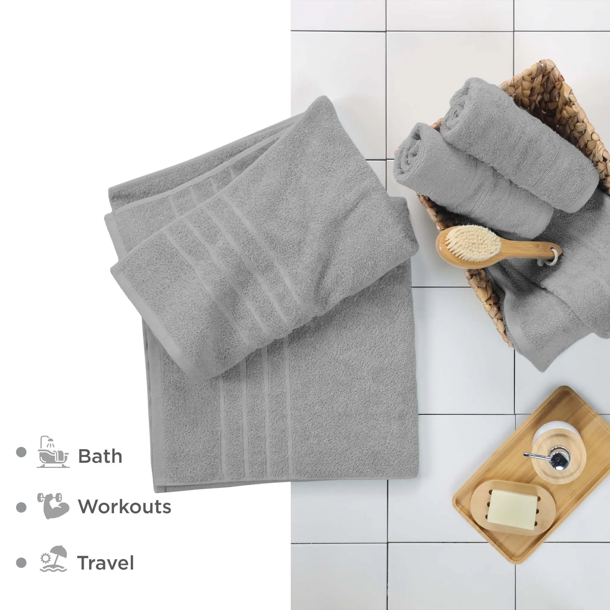 A set of gray bath sheet, arranged on a white tiled floor and a small text list indicating use for bath, workouts, and travel.