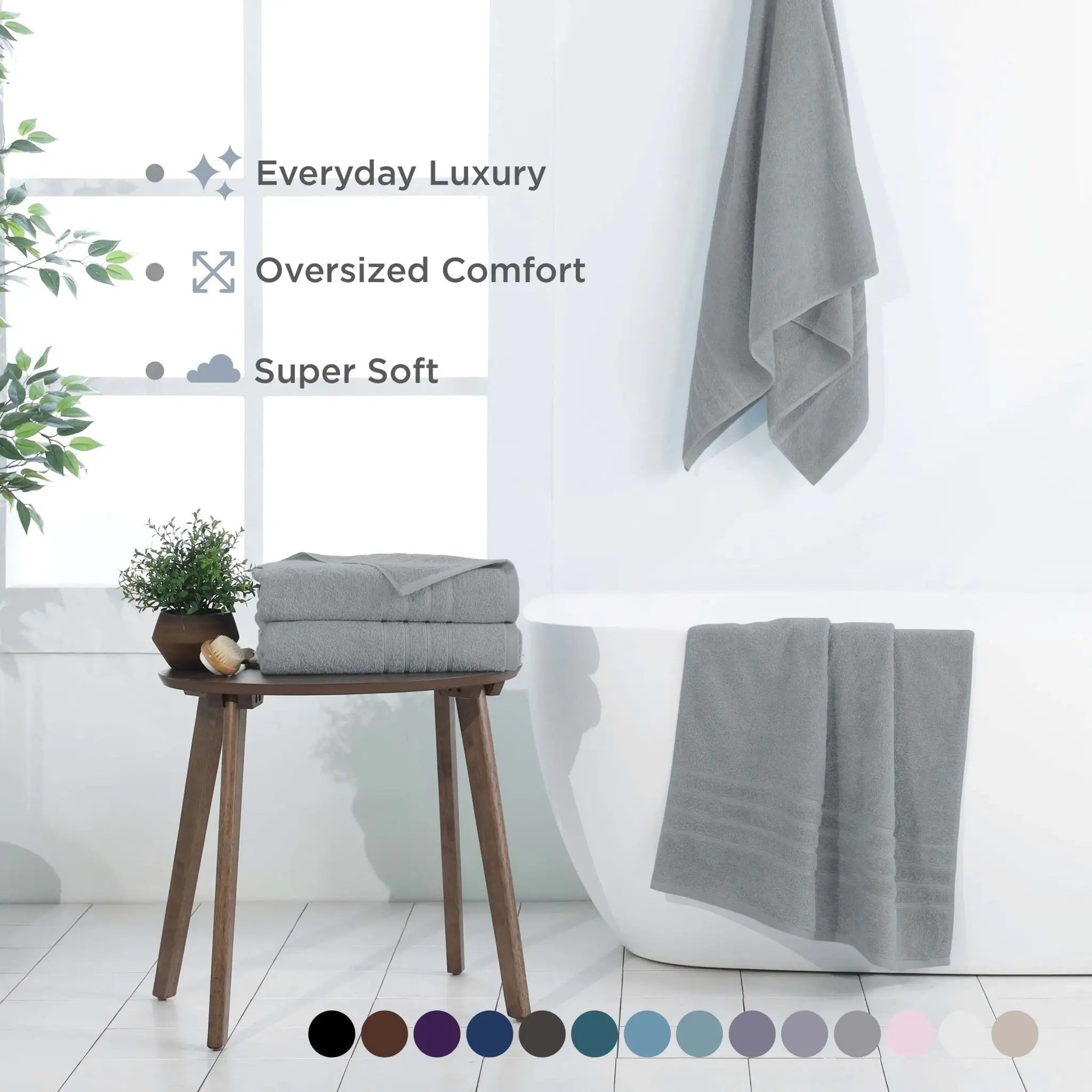 Spa blue bath sheets on a stool and hanging on a towel rack with text highlighting features.
