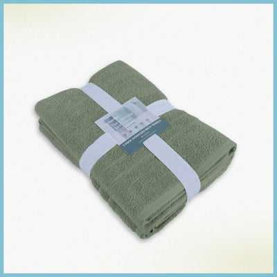 A folded set of sage bath sheets wrapped with a white paper band and a small product tag.