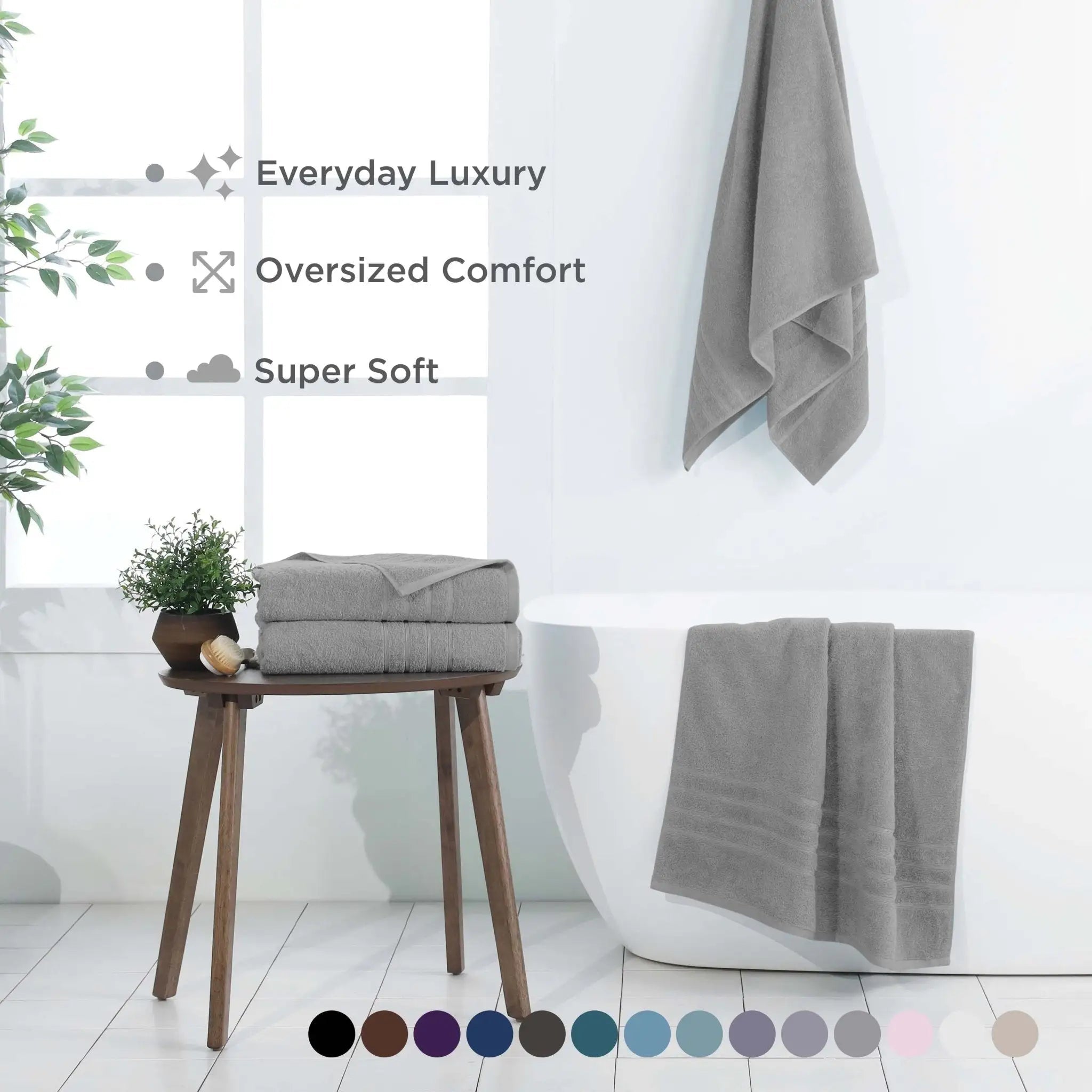 Gray bath sheets on a stool and hanging on a towel rack with text highlighting features.