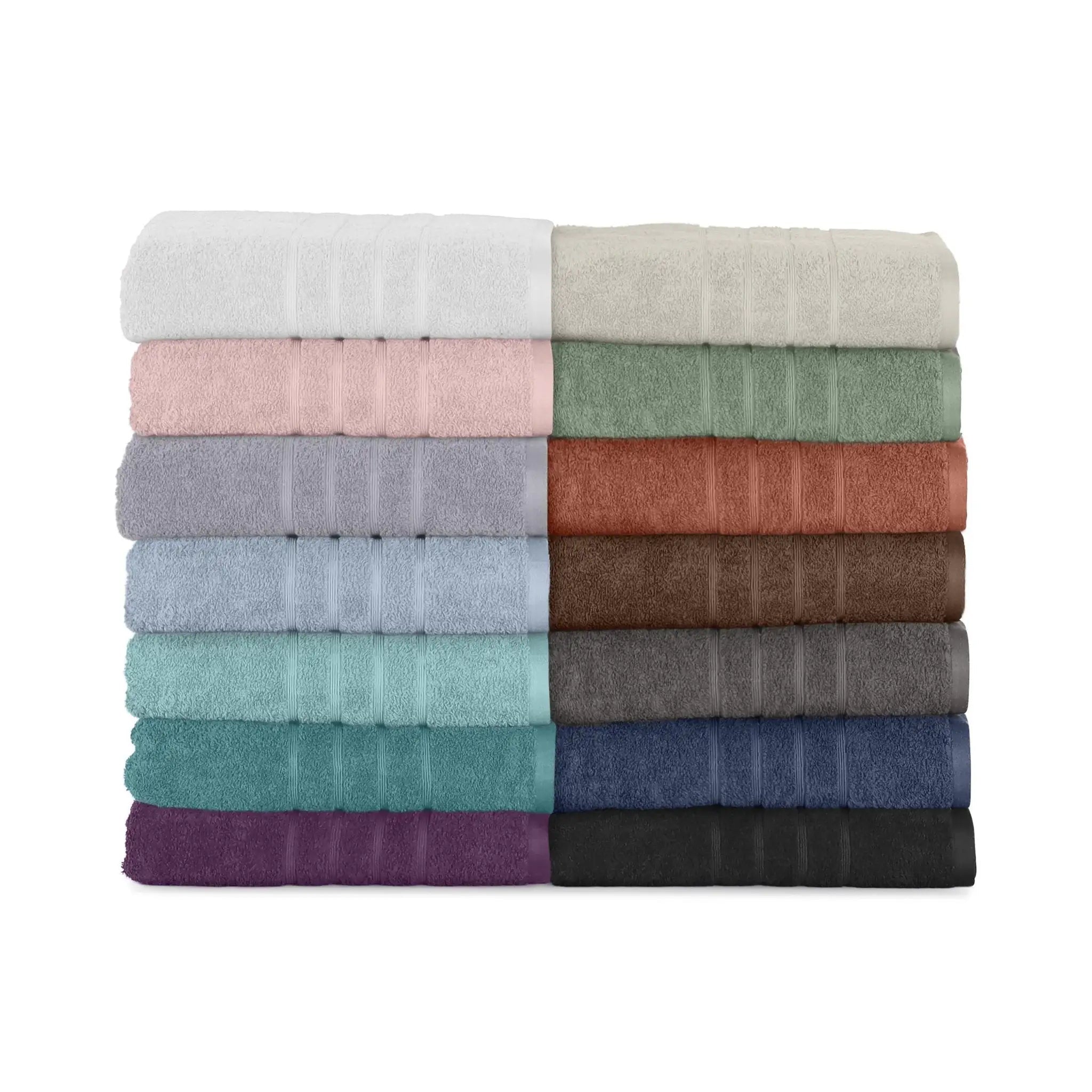 A stack of folded bath sheets in multiple colors, arranged in two columns of seven.