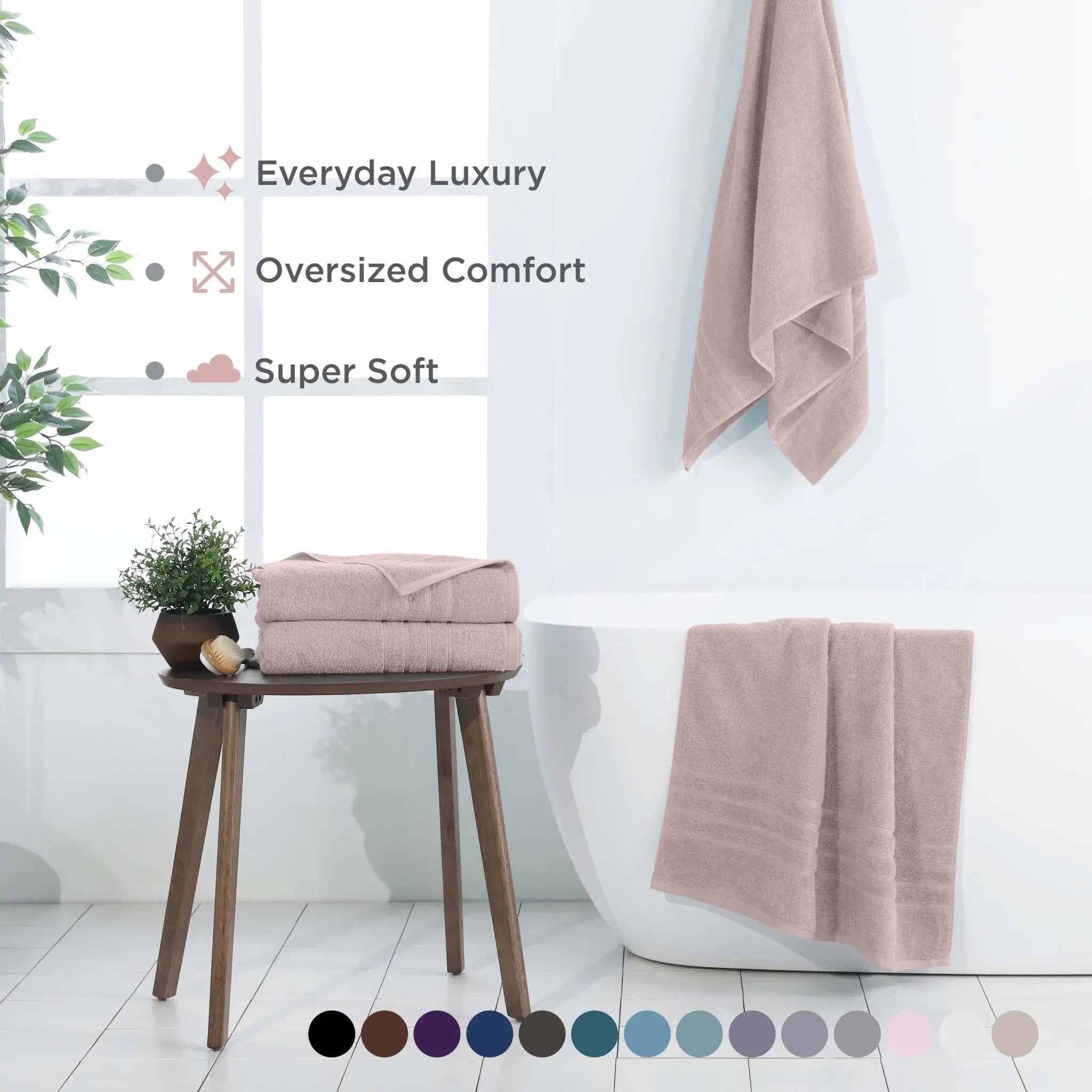 A set of soft, oversized bath sheets in a pink color.