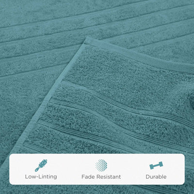 A close-up of a teal bath sheet with horizontal ribbed stripes, showing its soft terry texture. A white banner at the bottom features icons and text highlighting product features: 'Low-Linting', 'Fade Resistant', and 'Durable'.