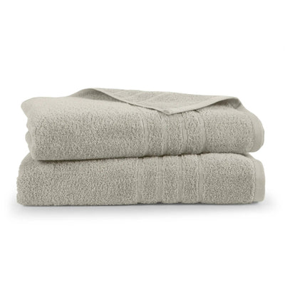 Two folded sand colored bath sheets on a white background