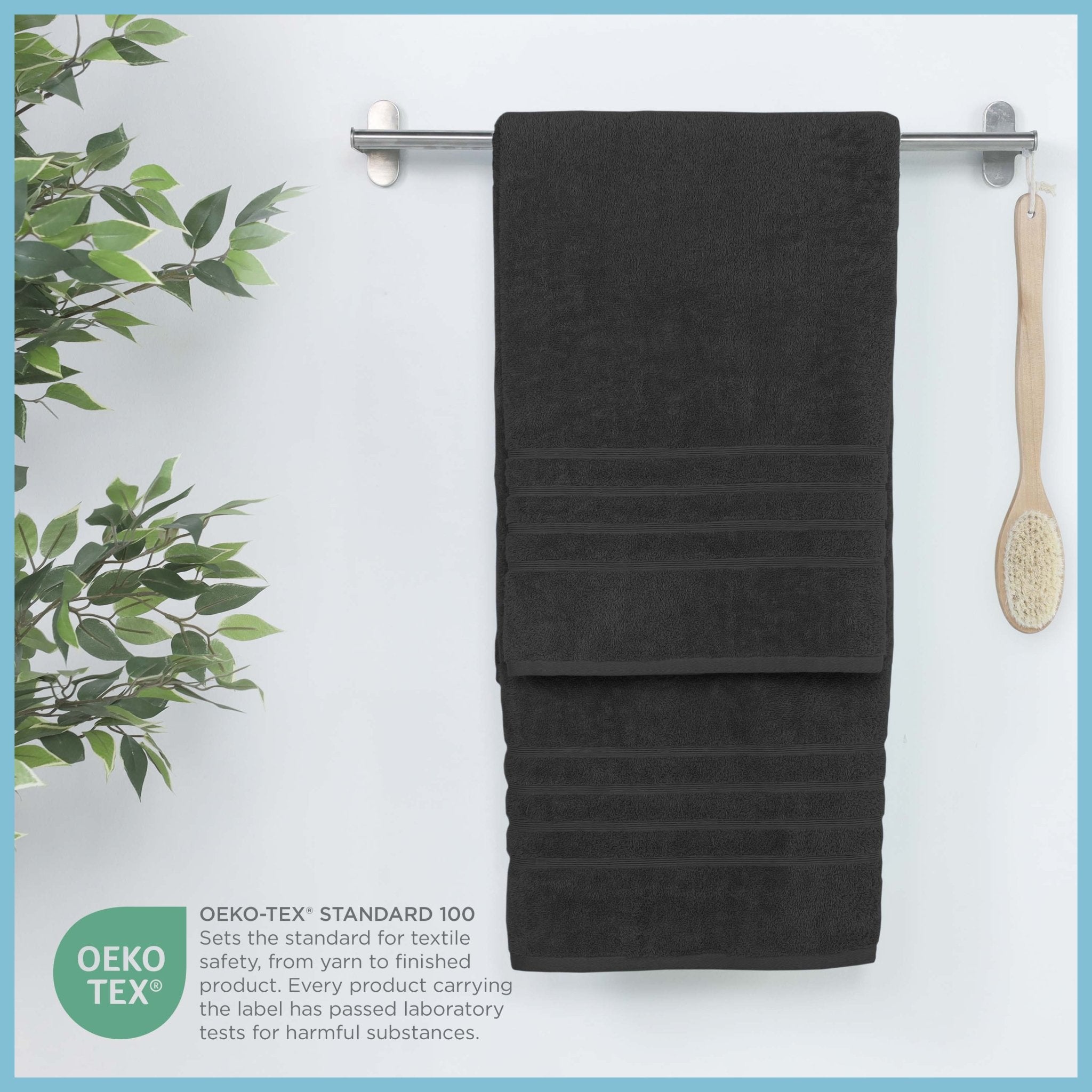 Black bath sheet hanging on a rack, featuring OEKO-TEX certification.