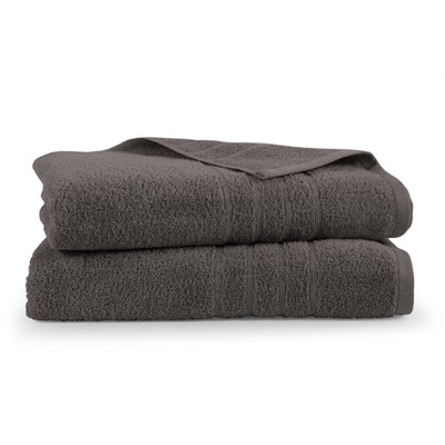 Two folded Eiffel tower bath sheets on a white background