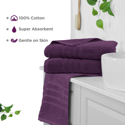 Dark purple bath sheets on a white cabinet with text highlighting features like 100% cotton, super absorbent, and gentle on skin.