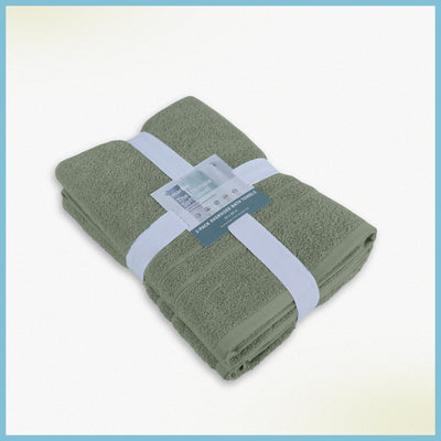 Folded sage bath sheets with a label on a white background