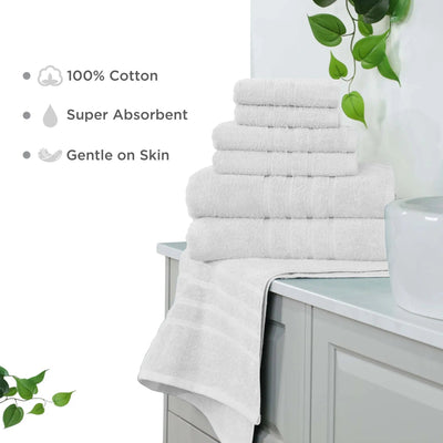 Stack of white towels on a bathroom counter with greenery and product features listed.