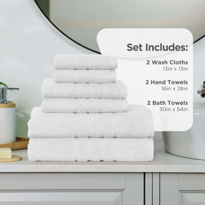 White towel set on a bathroom counter, with an informational overlay detailing the set contents: 2 wash cloths (13 in x 13 in), 2 hand towels (16 in x 28 in), and 2 bath towels (30 in x 54 in).