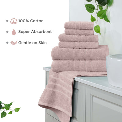 Stack of pink towels on a bathroom counter with text highlighting features.