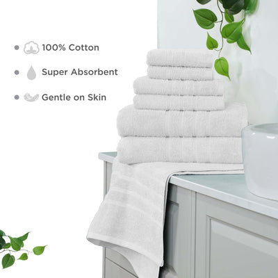 Stack of white towels on a bathroom counter with greenery and product features listed.