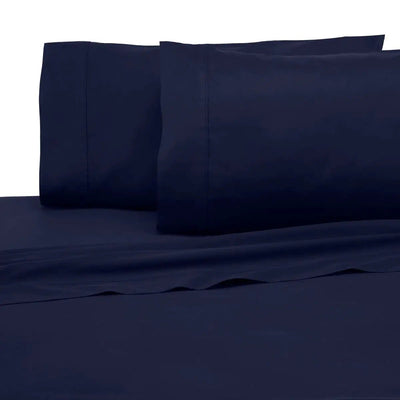 Navy blue bed sheets and pillowcases on a white background