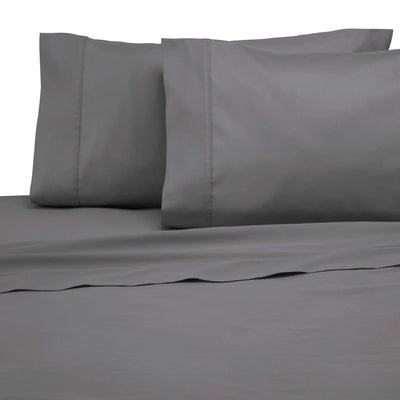 Gray bed sheets and pillowcases on a plain background