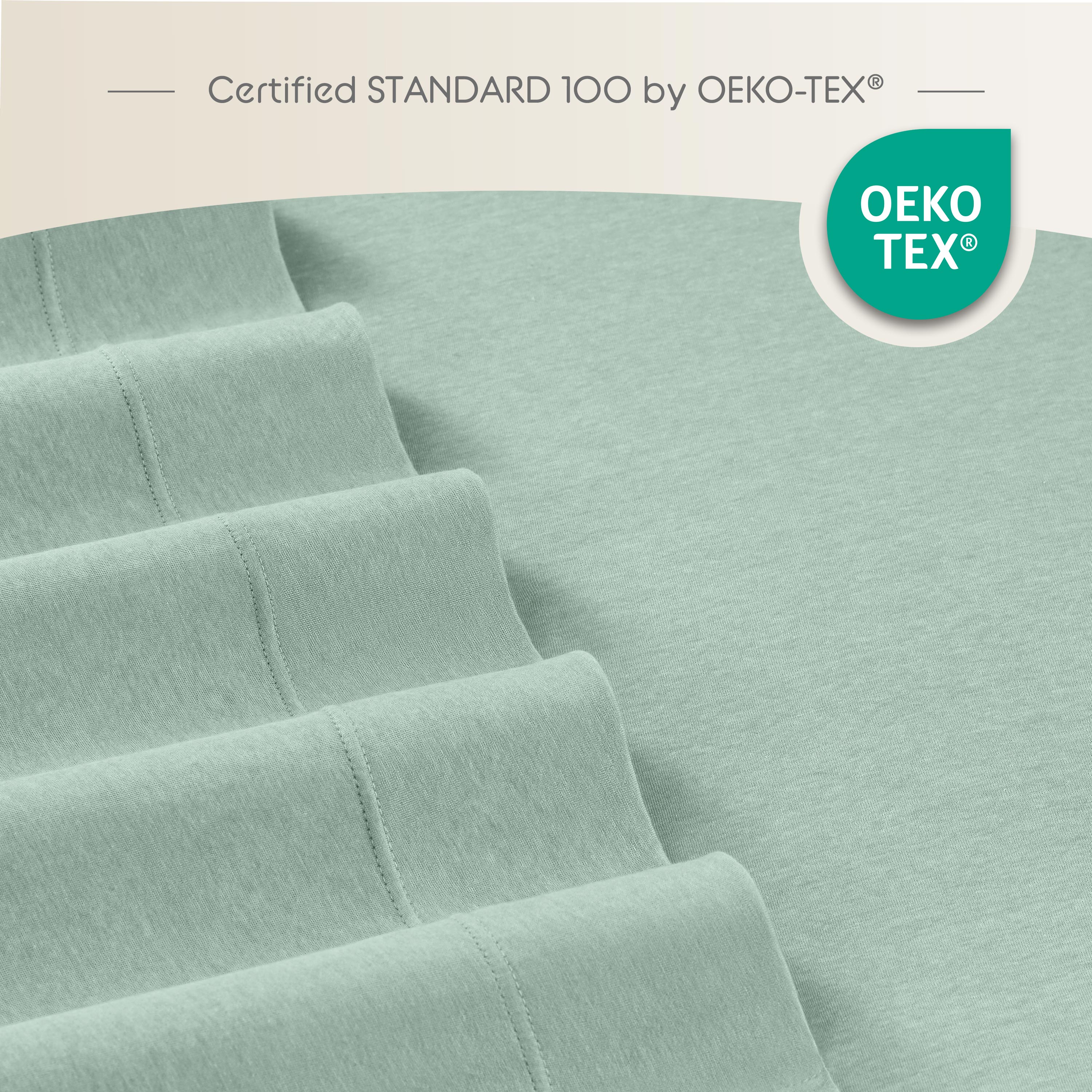 Soft mint green sheets with a smooth texture and visible stitching details.