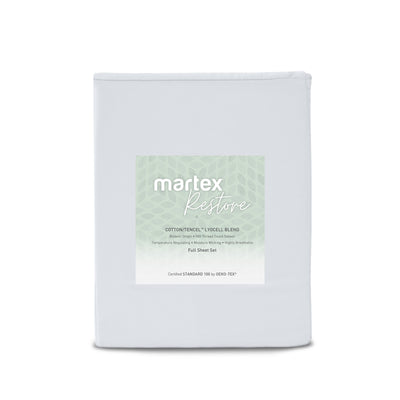 Solid light gray sheet set with a label detailing cotton and Tencel blend, full size, and care instructions.