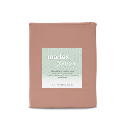 Solid peach sheet set with a label detailing material and features, packaged for retail display.