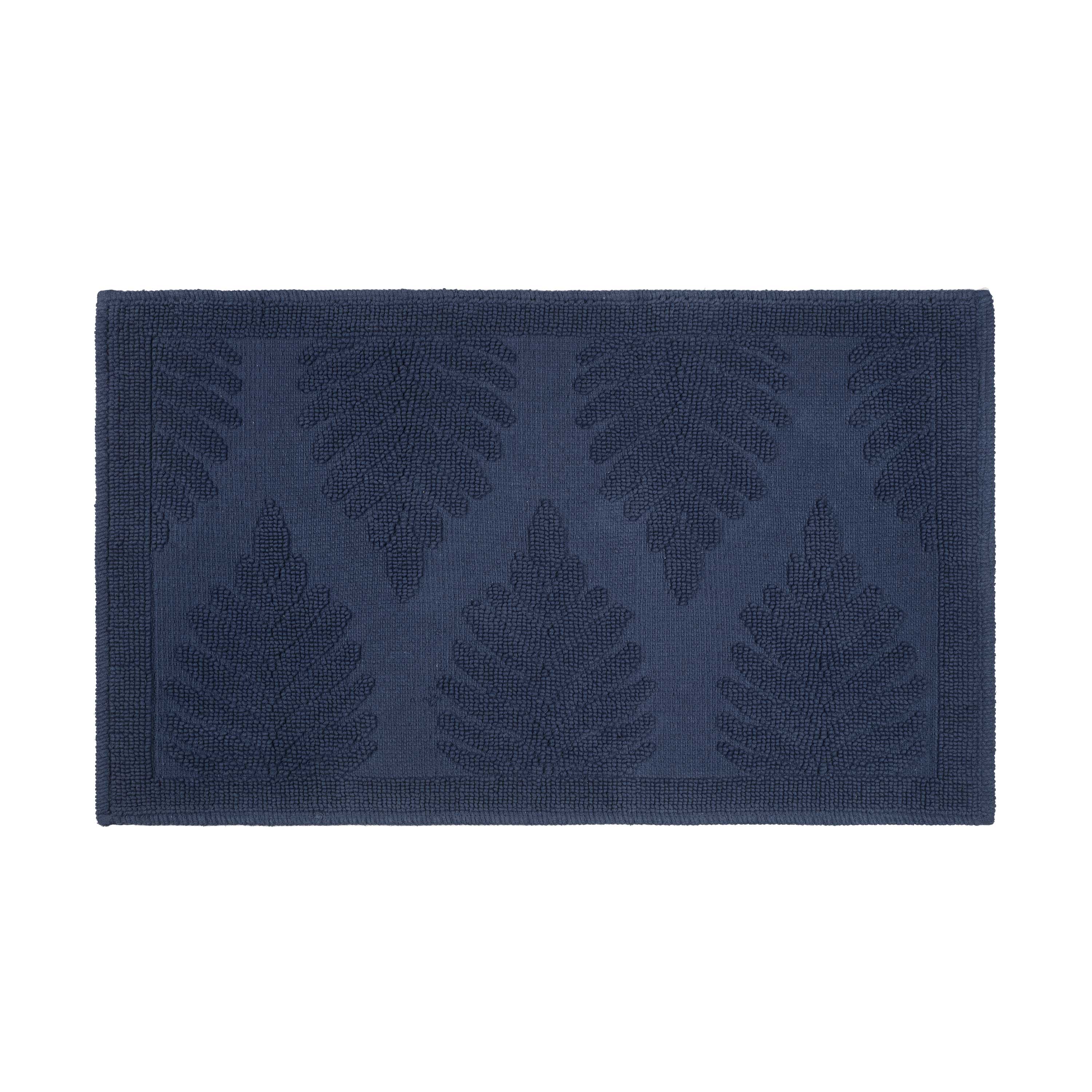 Navy bath rug featuring a textured fern leaf pattern on a solid background.