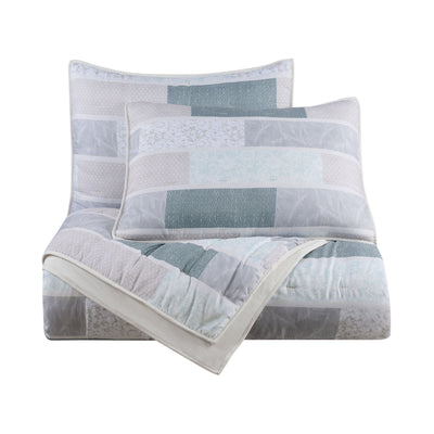 Quilt set featuring a patchwork design in soft colors with two matching pillow shams.