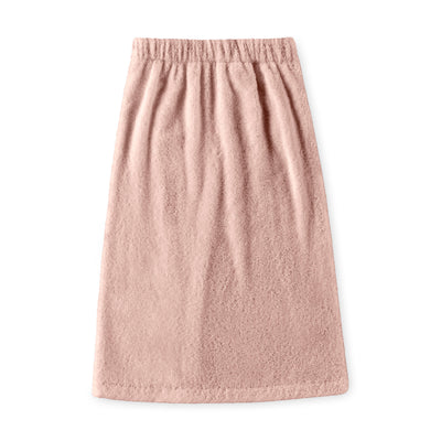 Soft pink youth shower wrap with an elastic waistband and textured fabric.