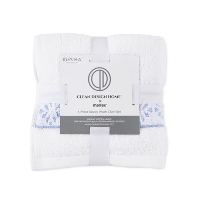 Four-piece wash cloth set featuring white towels with blue accents and a branded label.