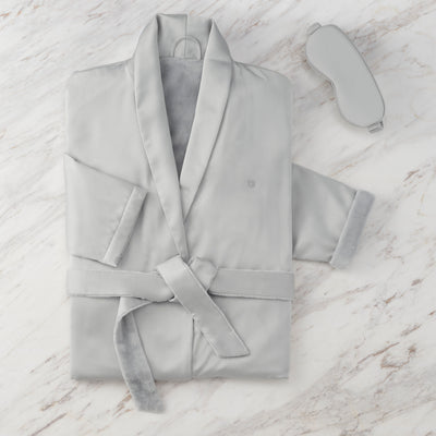 Gray satin robe with a matching eyemask, featuring a soft inner lining and a tied belt.