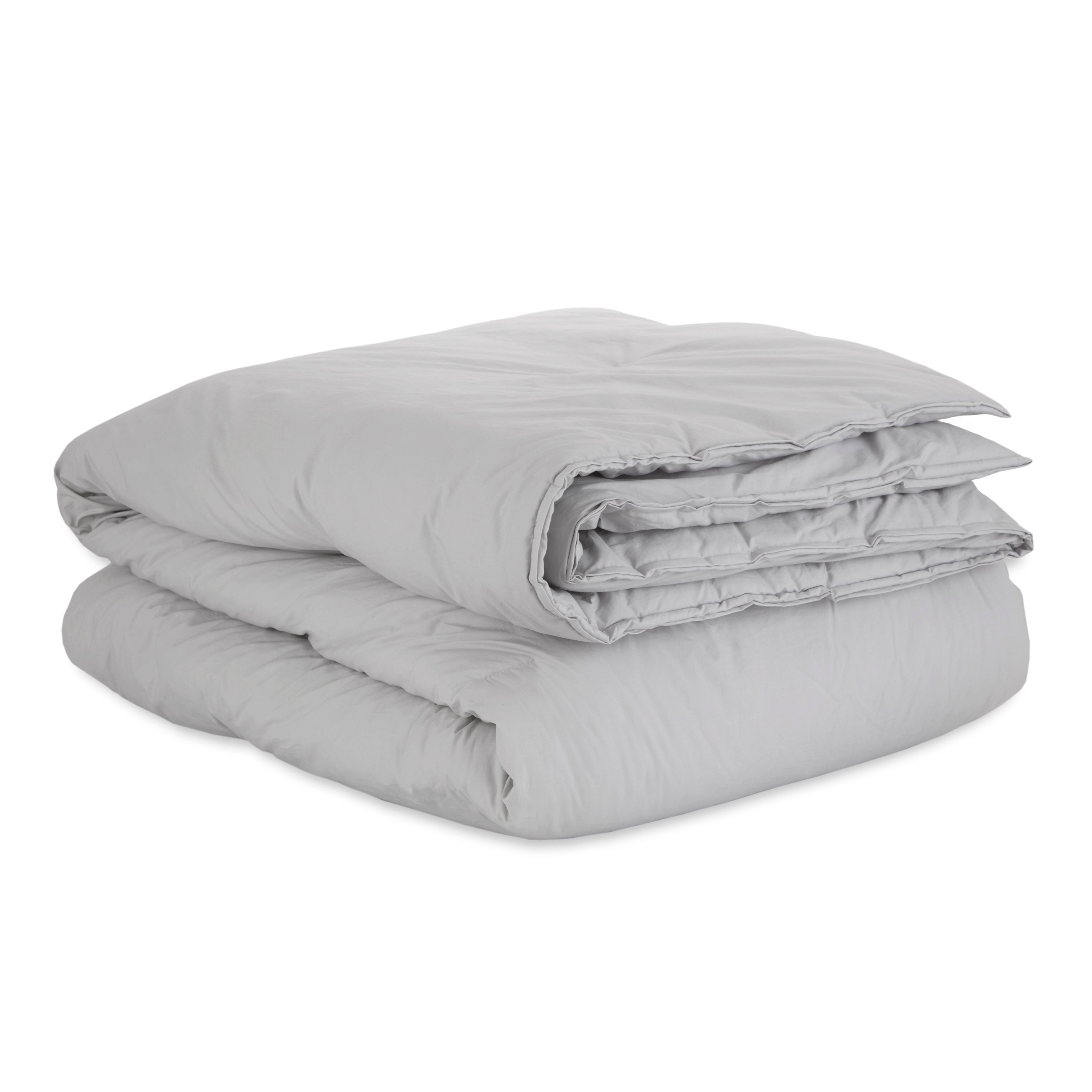 Light gray comforter set folded neatly, featuring a solid percale design with a smooth texture.
