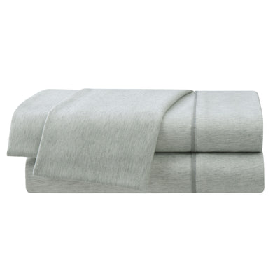 Light gray herringbone sheet set with a smooth texture, featuring folded sheets stacked neatly.