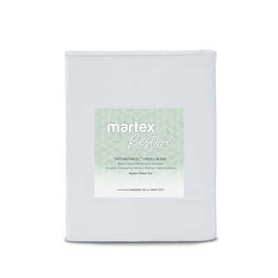 Solid light gray sheet set with a label indicating a cotton and Tencel blend, suitable for queen size beds.