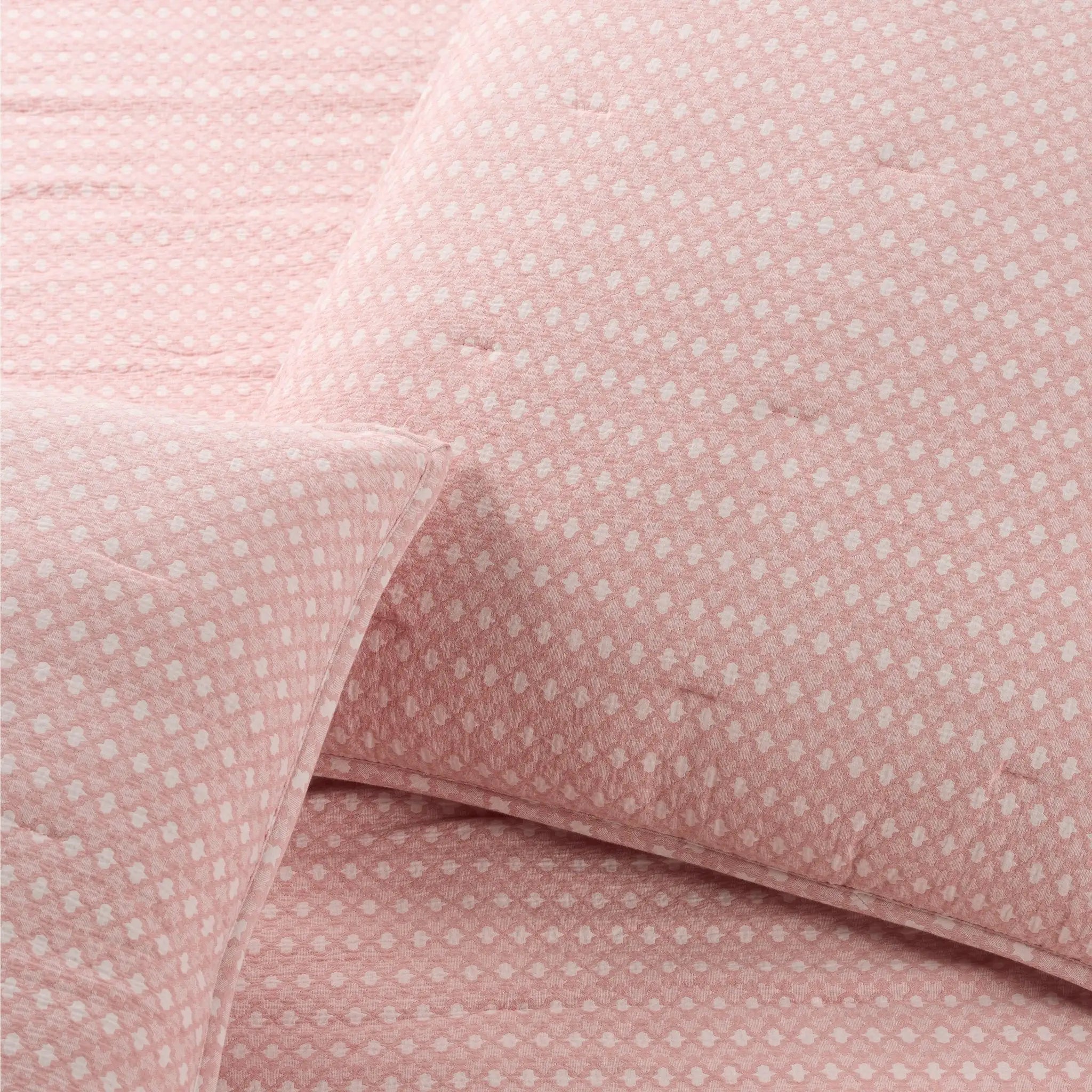 Close-up of pink fabric with a subtle pattern