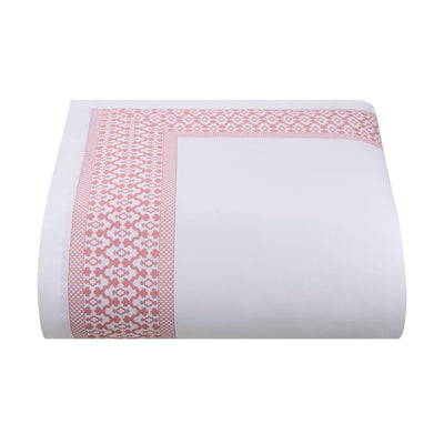 White comforter with pink geometric pattern on a white background