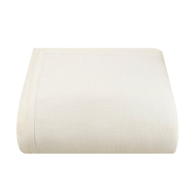 White comforter on a white background