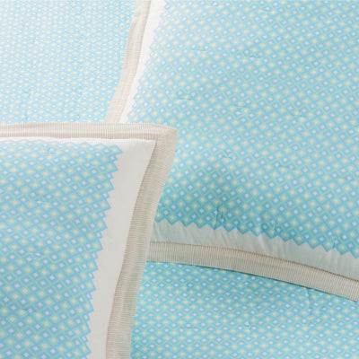 Light blue fabric with a subtle pattern on a light blue background