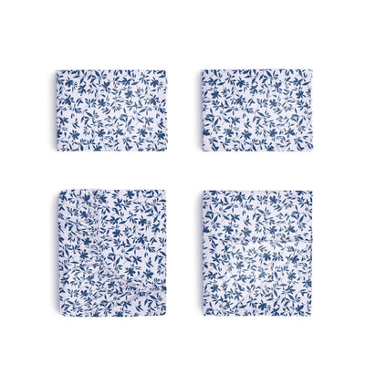 Four blue floral-patterned sheets on a white background