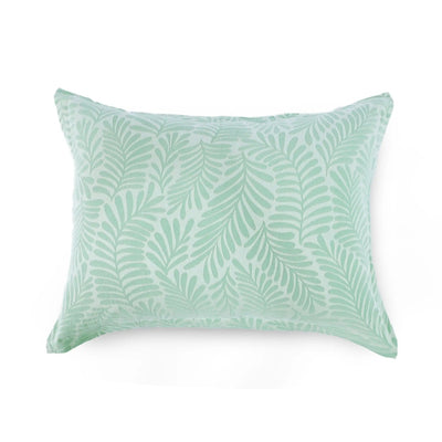 Green leaf-patterned pillow sham on a white background