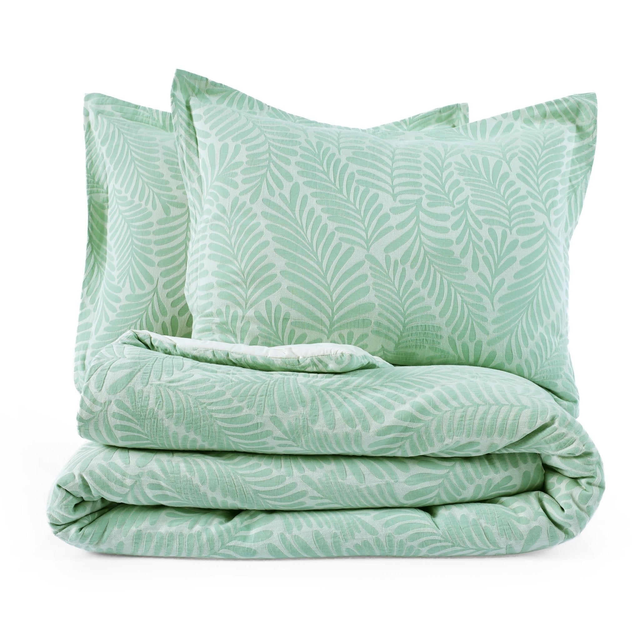 Green leaf-patterned comforter set on a white background