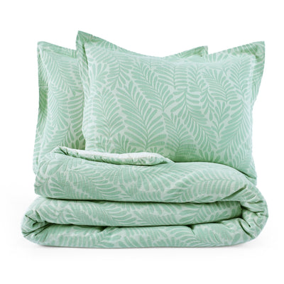 Green leaf-patterned comforter set on a white background