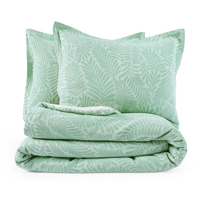 Green leaf-patterned comforter set with two pillow shams on a white background