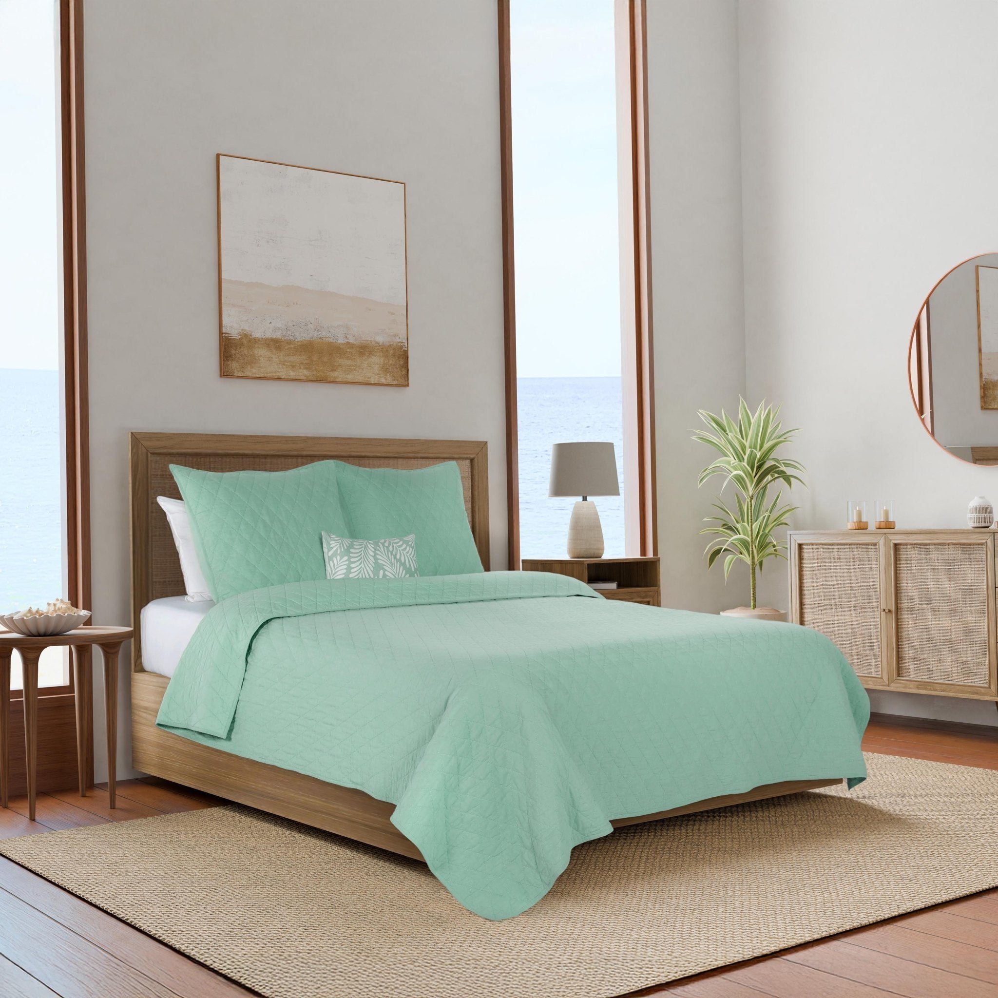 Bedroom with mint green bedding.